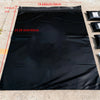A black poly mailer bag is shown spread out on a concrete surface, with dimensions labeled.