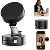 A black foldable magnetic phone holder device shown with a woman using it on a desk and in a hand.