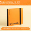 An orange sketchbook titled S*TARIVER with a black spine and black band, shown on a light background.