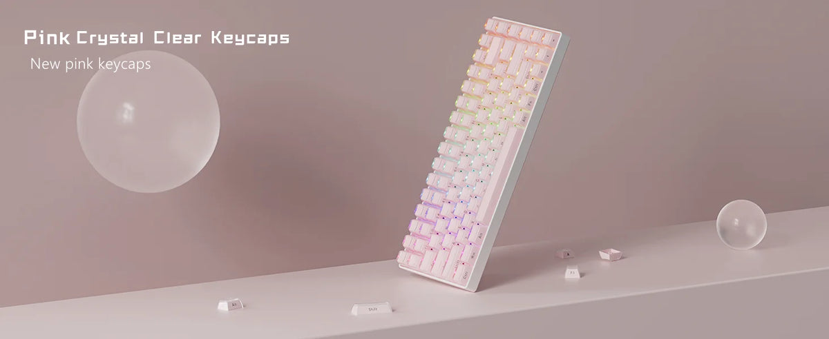 A close-up view of translucent pink clear keycaps arranged in a row on a light surface.