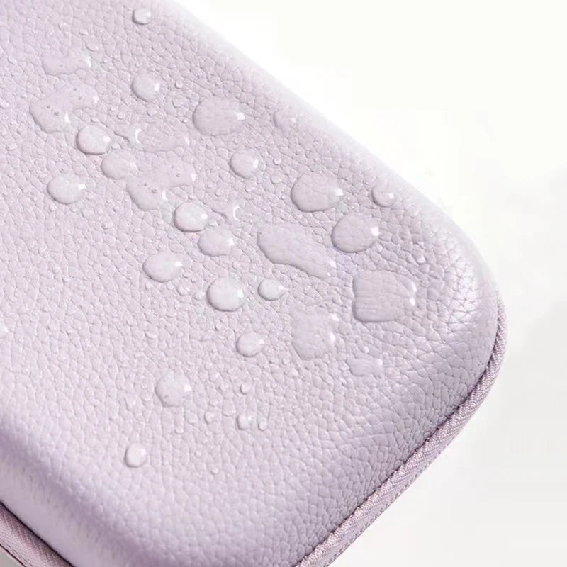 A close-up view of a light purple multi-use leather storage pouch organizer with a textured surface.