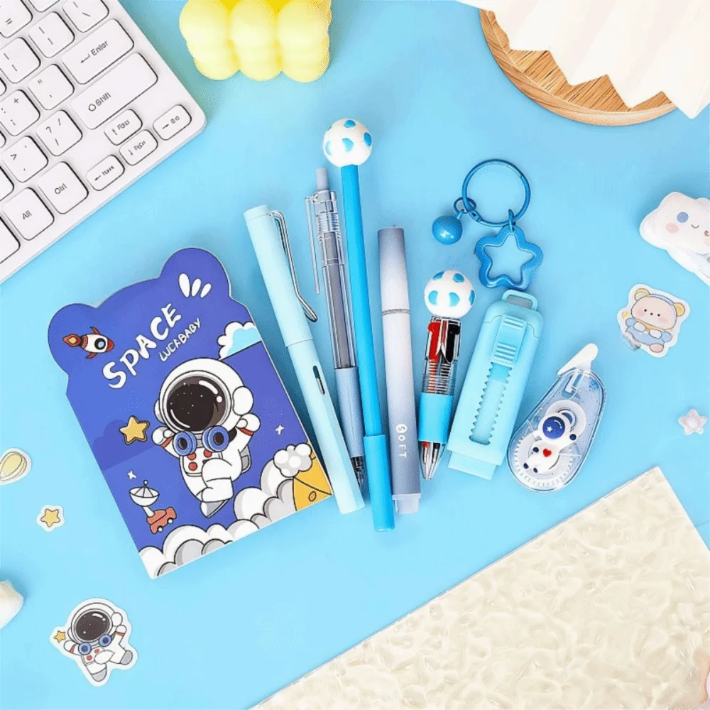 A blue and white cartoon school stationery kit featuring a notebook, pens, and various colorful tools on a light blue backgro