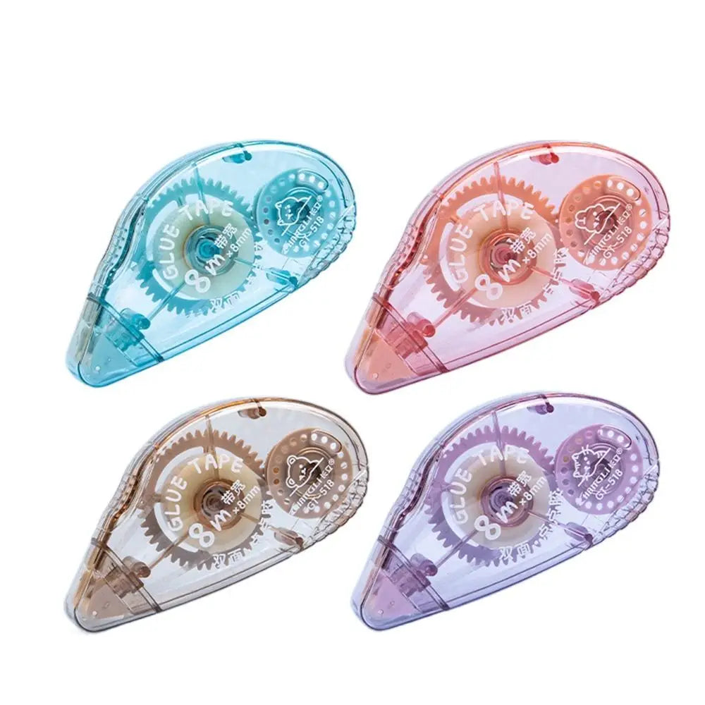 Three pieces of heavy duty double-sided adhesive tape in shades of blue, pink, and purple shown at an angle.