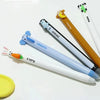 A set of six cute animal-themed erasable gel pens featuring characters like a monkey, penguin, elephant, and panda.
