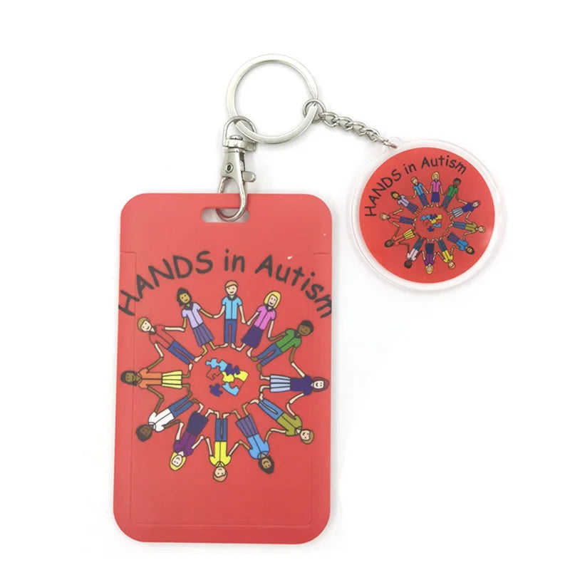 Rotes Acryl-Anhänger mit Autismus-Bewusstseins-Design und Metall-Schlüsselring.