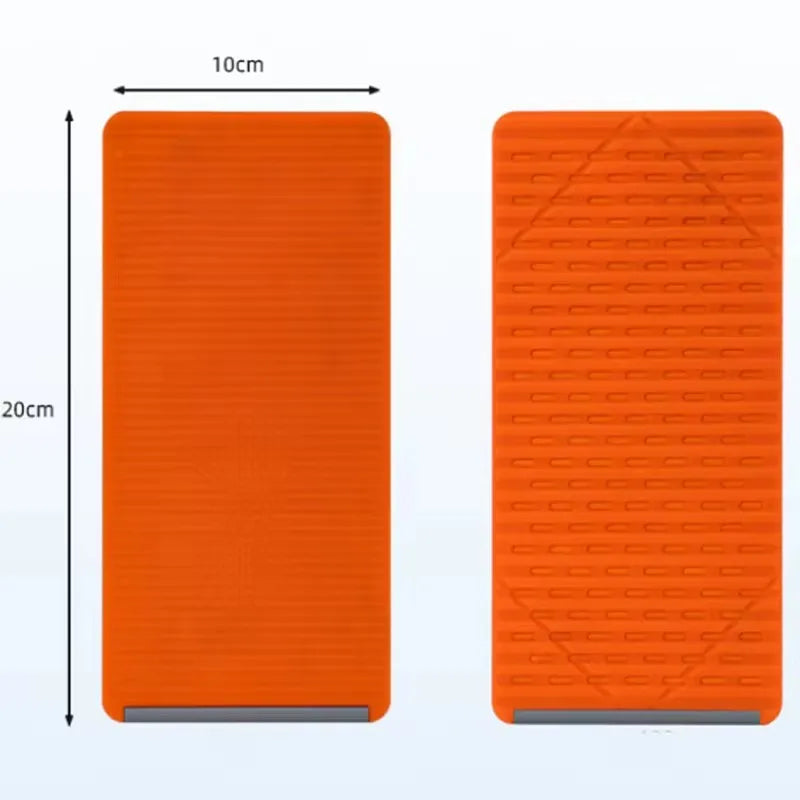 Orange silicone device stand with a textured surface and multiple angle supports.