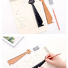 A wooden drawing ruler featuring a cute cartoon cat design, shown alongside other rulers and drawing tools.