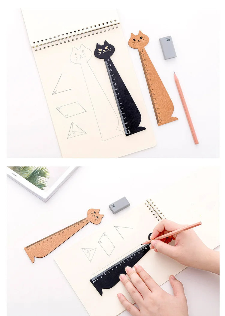 A wooden drawing ruler featuring a cute cartoon cat design, shown alongside other rulers and drawing tools.