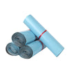 Roll of light blue reusable waterproof poly shipping bags tied with a red string