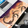 An XXL Gengar gaming mouse pad desk mat featuring a vibrant orange and purple dragon print on a white surface.