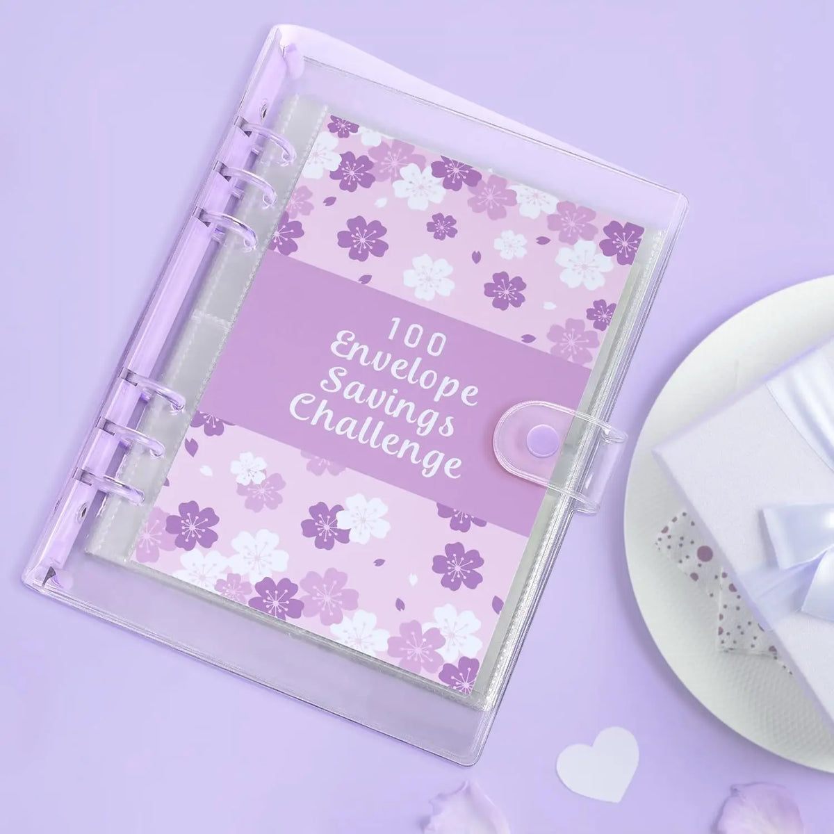 A clear plastic envelope planner with a purple floral pattern for a 100 Envelope Savings Challenge