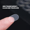 A hand holds a clear, double-sided adhesive fixer pad against a dark background.