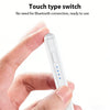 A hand holds a white touch type switch stylus pen, demonstrating its use for devices.