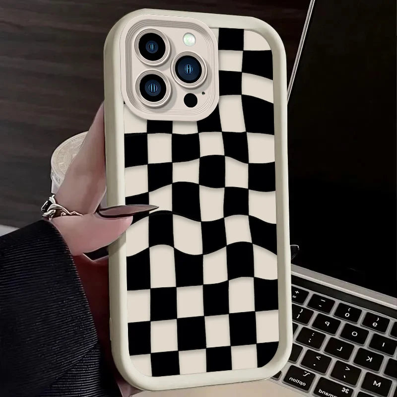 A white silicone phone case with a black and white checkered pattern is shown on a smartphone.