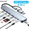 A silver USB 3.0 Type-C multiport hub with multiple ports including USB 3.0, USB 2.0, SD/TF card reader, and an audio jack.