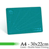 A green A4 cutting mat with grid guides and double-sided printing.