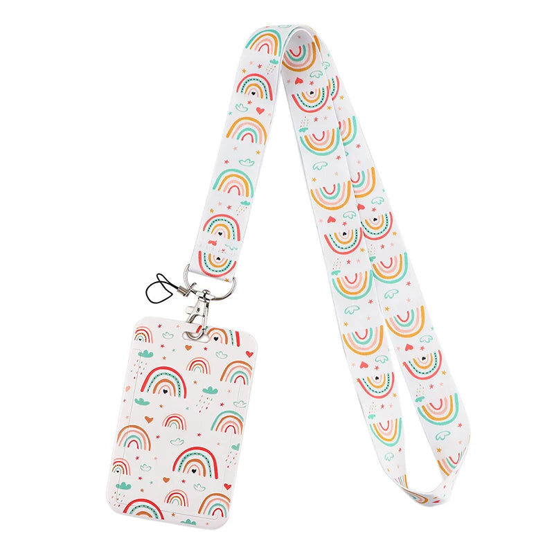 A white and multi-colored rainbow patterned lanyard with a clip attached.