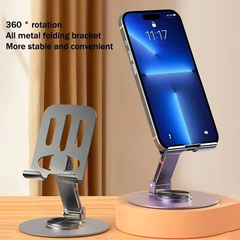 Support pliable en métal pour smartphone avec fonction de rotation 360 degrés sur une surface en bois orange.