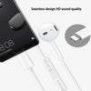 White wired earbuds with microphones and a USB connector shown next to a smartphone.