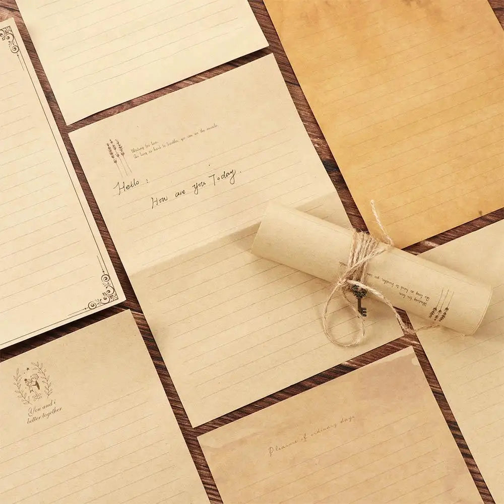 A set of vintage European style letter and invitation envelopes with handwritten notes and a rolled parchment paper.