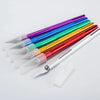 A collection of ten colorful precision craft knives with various blade shapes and colors laid out diagonally.