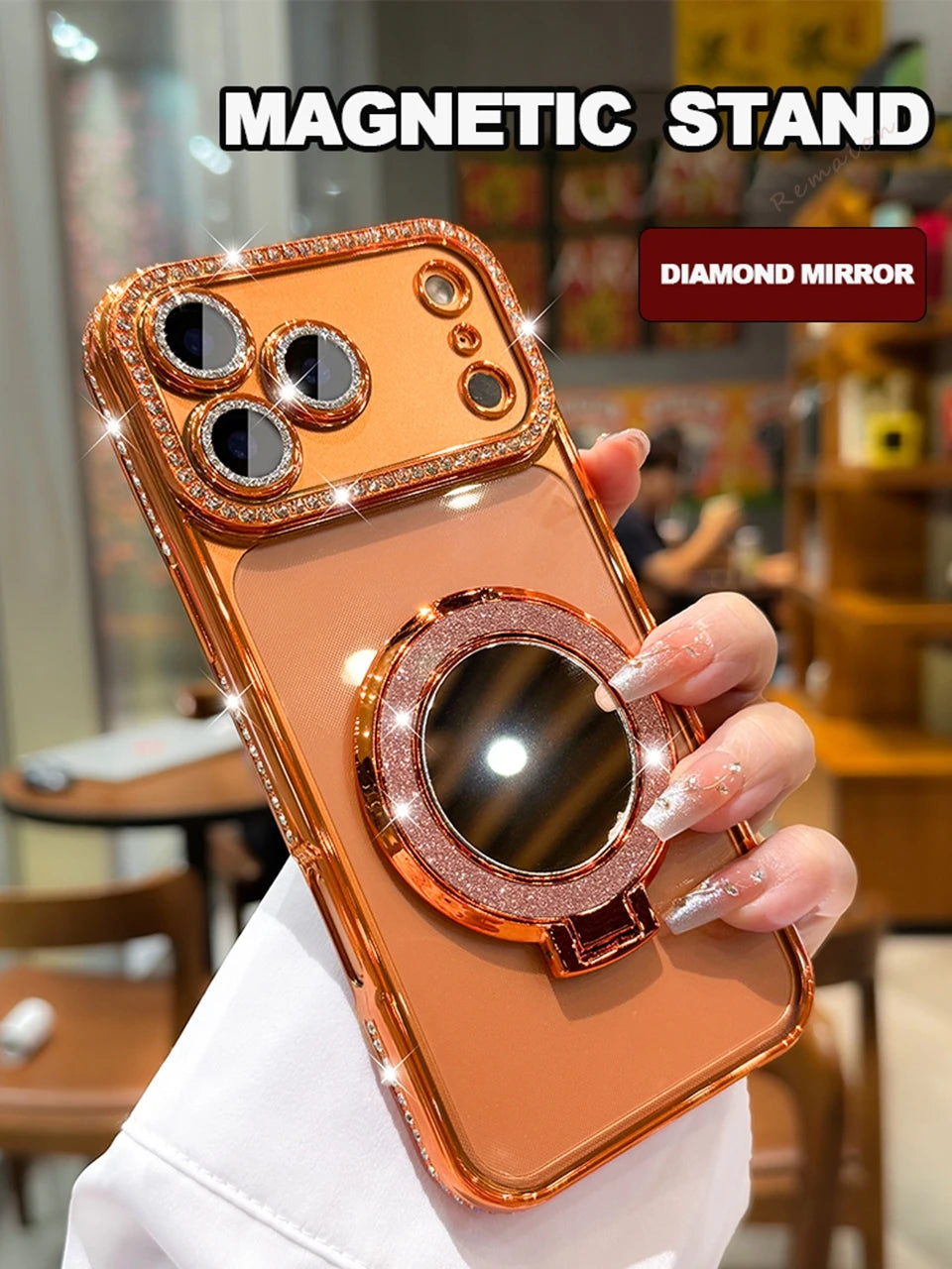 Nahaufnahme eines orangen glitzernden Magnet-Stands für ein iPhone mit Diamantspiegel-Design.