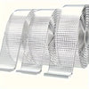 Rolls of heavy duty double-sided transparent mounting tape stacked and displayed