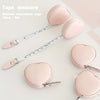 Pink PU leather measuring tape shown next to heart-shaped silicone measuring tools.