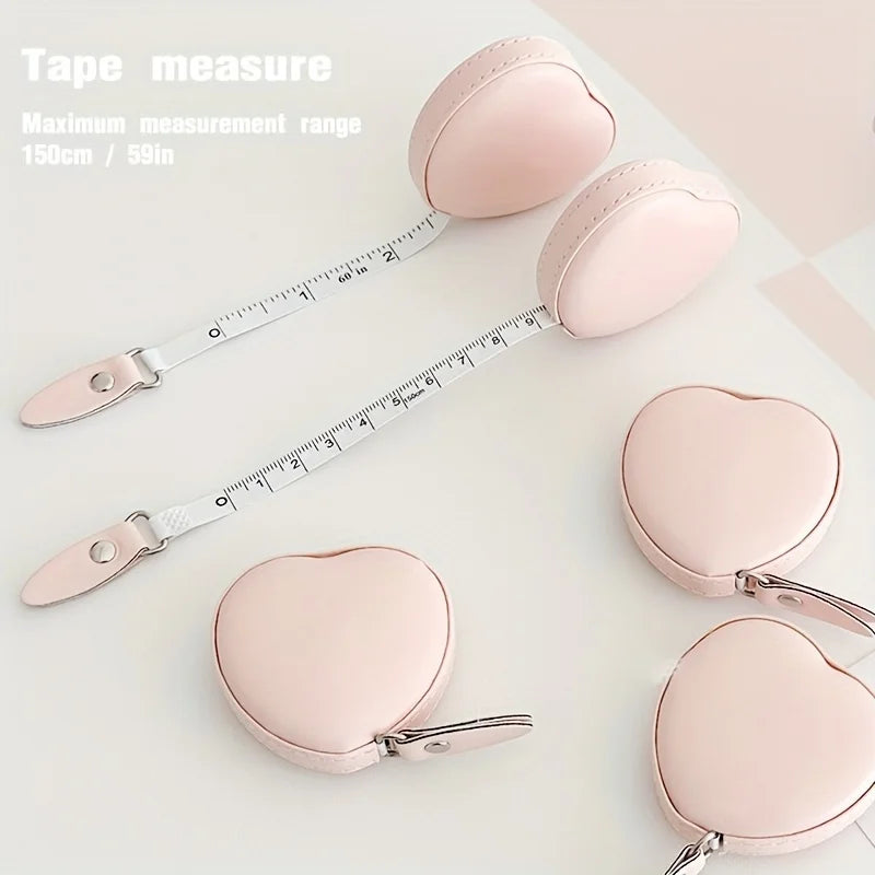 Pink PU leather measuring tape shown next to heart-shaped silicone measuring tools.