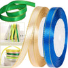 Rolls of gold, green, and blue satin ribbon for crafting and decoration