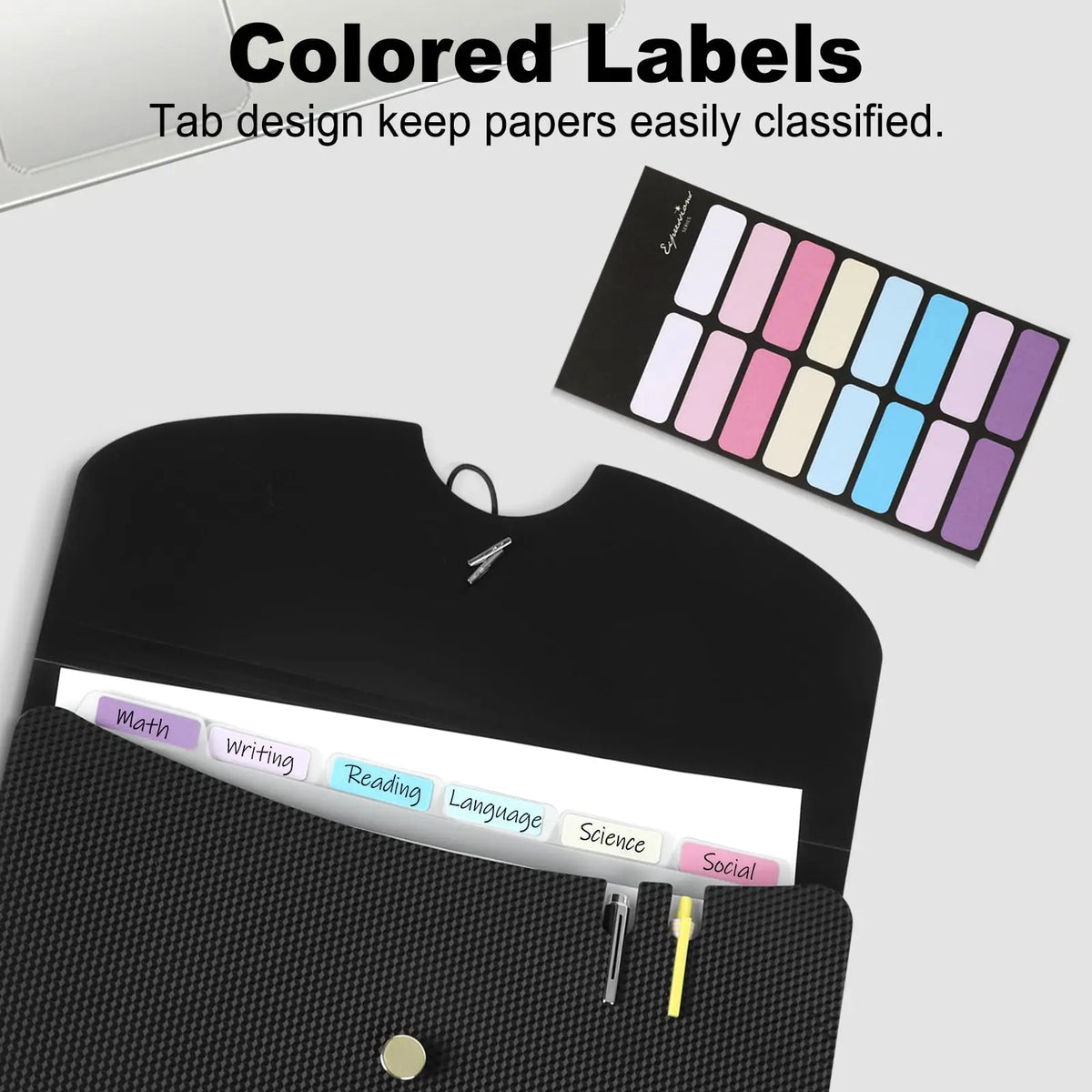 A black accordion file organizer with colored labels for classifying papers.