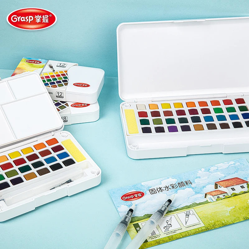 A white 12-in-1 watercolor paint set with various colors and water brush pens is displayed on a light blue surface.