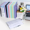 A set of colorful A4 document and photo storage file boxes arranged in a row next to an open box labeled Le sac en papier
