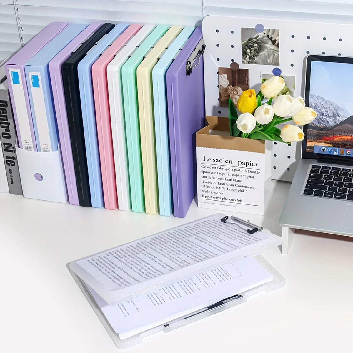A set of colorful A4 document and photo storage file boxes arranged in a row next to an open box labeled Le sac en papier