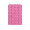 A pink silicone suction cup product featuring 24 small circular cups for mounting phones and tablets.