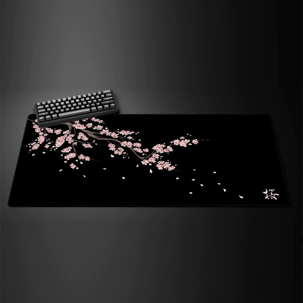 Black gaming mouse pad featuring a delicate pink cherry blossom branch design.