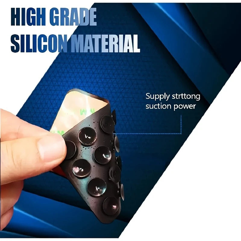 A hand holds a multi-pack of silicone suction phone mounts against a dark blue background.
