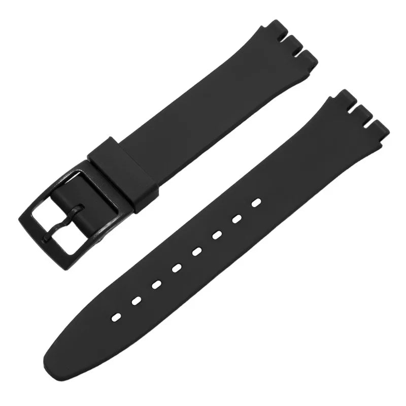 Black silicone watch strap with replacement tools and buckle visible.