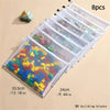 A set of eight clear mesh zipper storage bags filled with colorful building blocks and a small toy car.