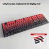 A close-up view of a black mechanical keyboard featuring various PBT keycaps in red, purple, and black colors.