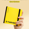 A yellow marker sketchbook is held by a hand against a light background.
