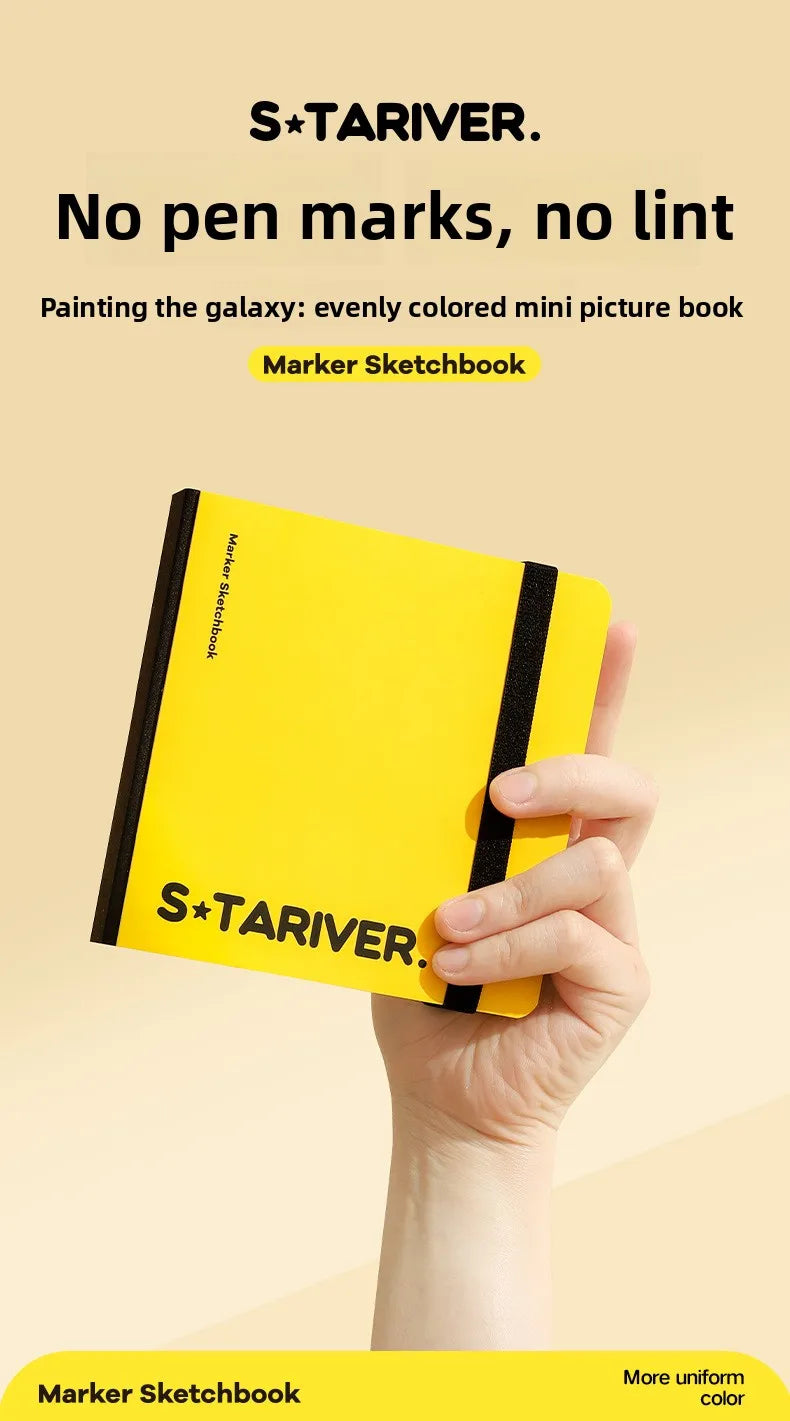 A yellow marker sketchbook is held by a hand against a light background.