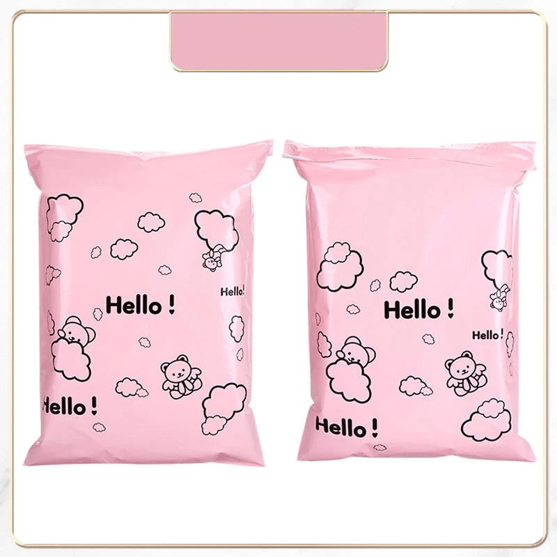 Two pink reusable plastic mailing bags featuring a cloud and bear design.
