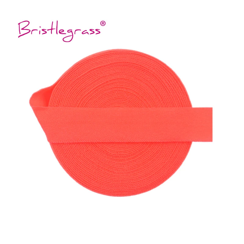 A roll of bright orange adjustable spandex elastic hair ties and trims.