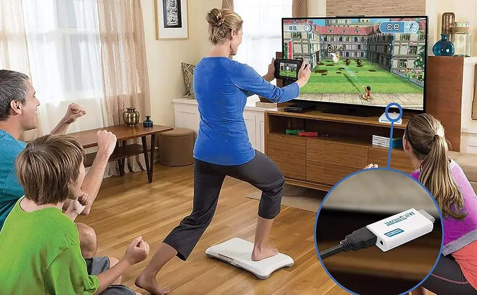 A woman is using a Wii to HDMI converter adapter on a floor mat to connect a console to a television.