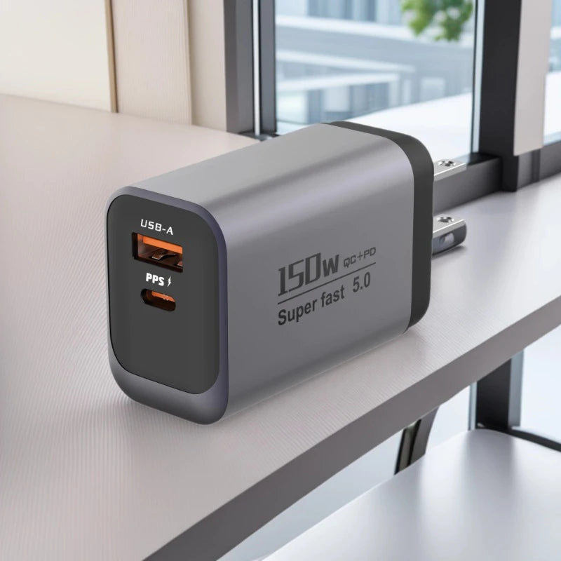 A silver wall charger with USB-A and PPS ports is placed on a light gray shelf.