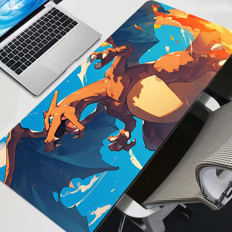 An XXL Gengar gaming mouse pad desk mat featuring a vibrant orange and blue dragon print on a white laptop.