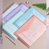 A stack of transparent plastic document folders in various pastel colors, including purple, mint green, and peach.