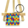 Buntes Puzzle-Teil-Muster-Lanyard-Ring an Holzstäbchen befestigt.