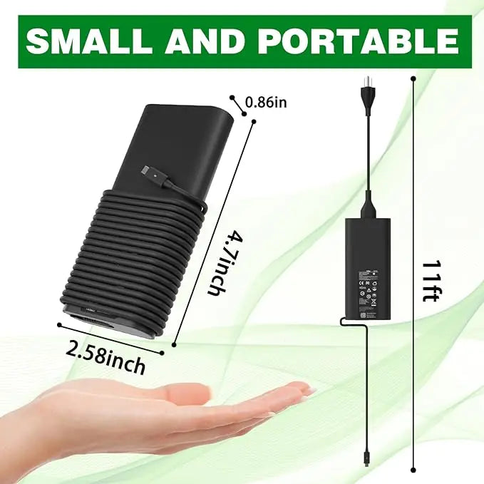 A black portable laptop charger with a flexible cord is shown next to a hand, highlighting its small and portable design.